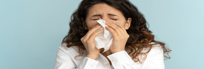 allergies-lady blowing nose